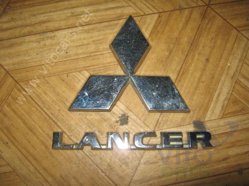 Эмблема (логотип, значок) Mitsubishi Lancer 9 [CS/Classic] (с разборки)